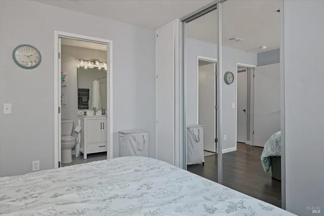 a bedroom with a bed and a bathroom