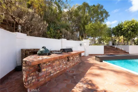 a view of a backyard with sitting area