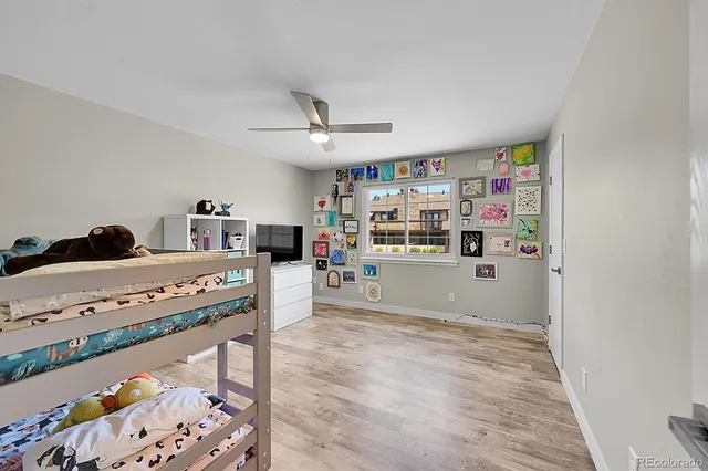 a view of kitchen with stainless steel appliances granite countertop a stove and a refrigerator