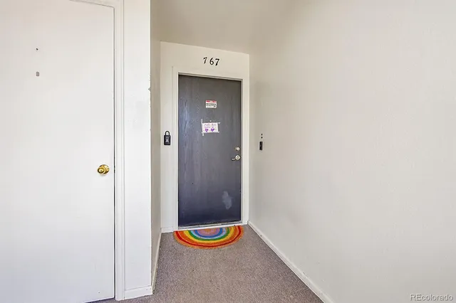 a view of room with dining area and wooden floor