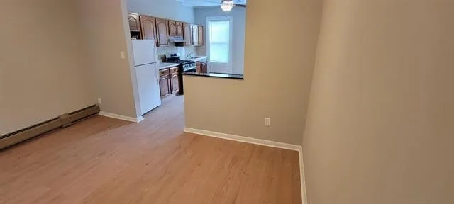 a view of a kitchen from the hallway