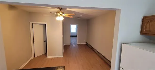 a view of a hallway with a chandelier