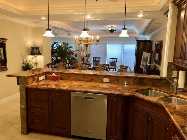 197 Durango Road, Unit 6C Destin, FL 32541 - Photo 18 of 62 a kitchen with a sink and a wooden floor