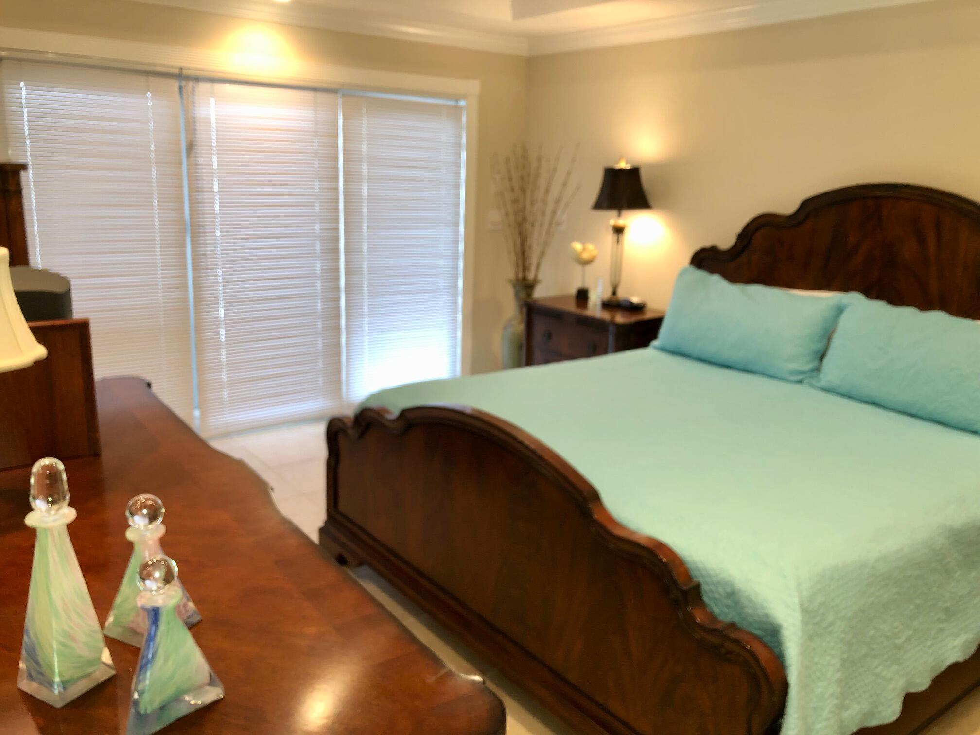 197 Durango Road, Unit 6C Destin, FL 32541 - Photo 22 of 62 a bedroom with a bed and a window