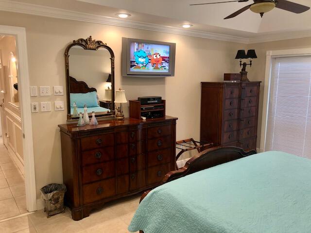 197 Durango Road, Unit 6C Destin, FL 32541 - Photo 23 of 62 a bedroom with a bed and a television