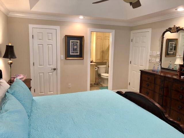 197 Durango Road, Unit 6C Destin, FL 32541 - Photo 28 of 62 a bedroom with a bed and a dresser