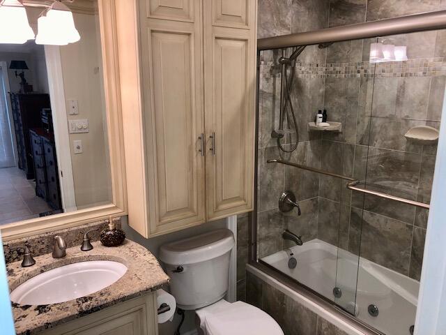 197 Durango Road, Unit 6C Destin, FL 32541 - Photo 30 of 62 a bathroom with a granite countertop sink toilet and shower