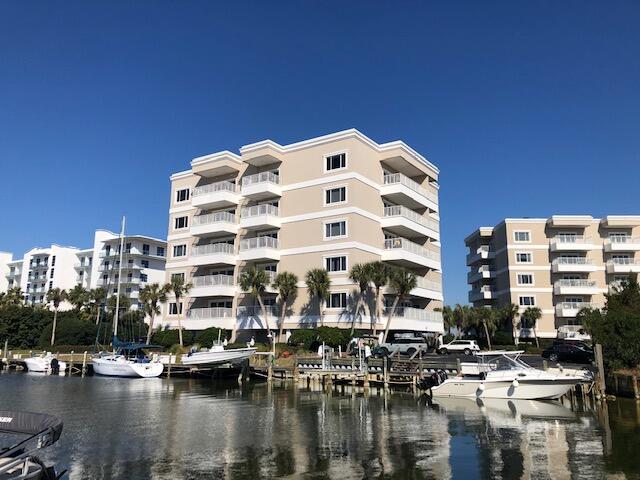 197 Durango Road, Unit 6C Destin, FL 32541 - Photo 3 of 62 a tall building sitting next to a lake