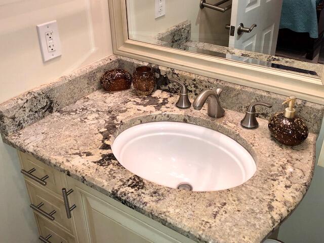 197 Durango Road, Unit 6C Destin, FL 32541 - Photo 31 of 62 a bathroom with a sink and a mirror