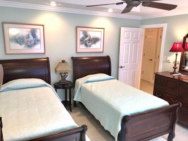 197 Durango Road, Unit 6C Destin, FL 32541 - Photo 38 of 62 a bed sitting in a bedroom next to a window