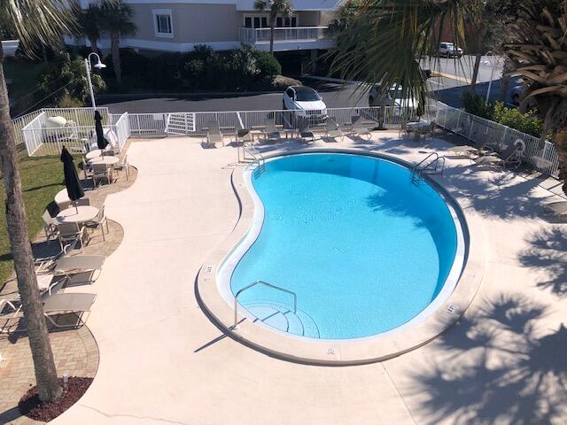 197 Durango Road, Unit 6C Destin, FL 32541 - Photo 53 of 62 a view of a swimming pool with outdoor seating