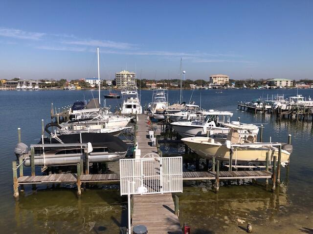 197 Durango Road, Unit 6C Destin, FL 32541 - Photo 57 of 62 a view of a lake with boats and trees in the background