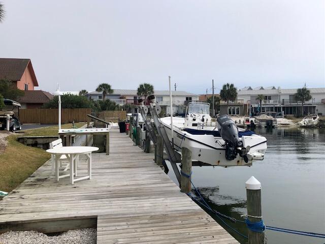 197 Durango Road, Unit 6C Destin, FL 32541 - Photo 59 of 62 a view of a terrace with chairs