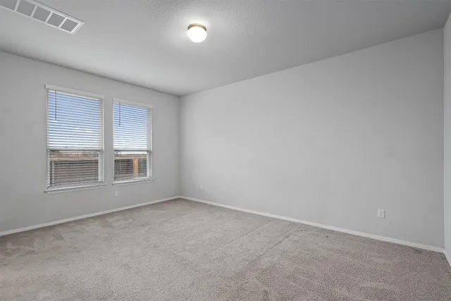 a kitchen that has a sink a stove and a wooden floors