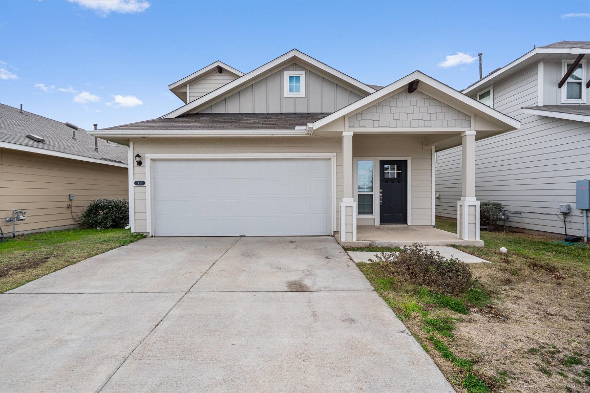 300 Delta Crest Maxwell, TX 78656 - Photo 2 of 36 a front view of a house with a yard and garage