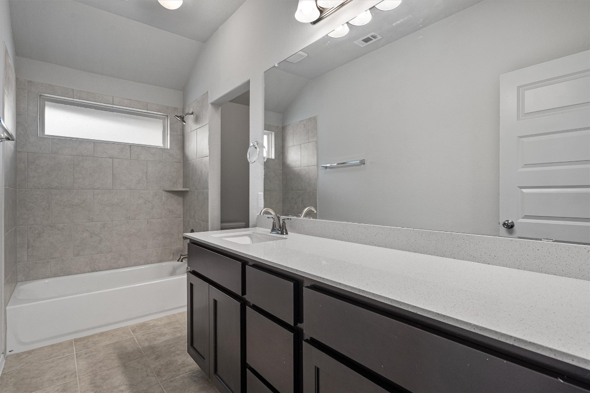 300 Delta Crest Maxwell, TX 78656 - Photo 25 of 36 a bathroom with a sink and a bathtub