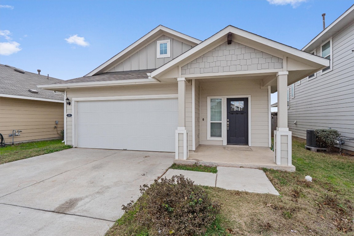 300 Delta Crest Maxwell, TX 78656 - Photo 4 of 36 a front view of a house with a yard and garage