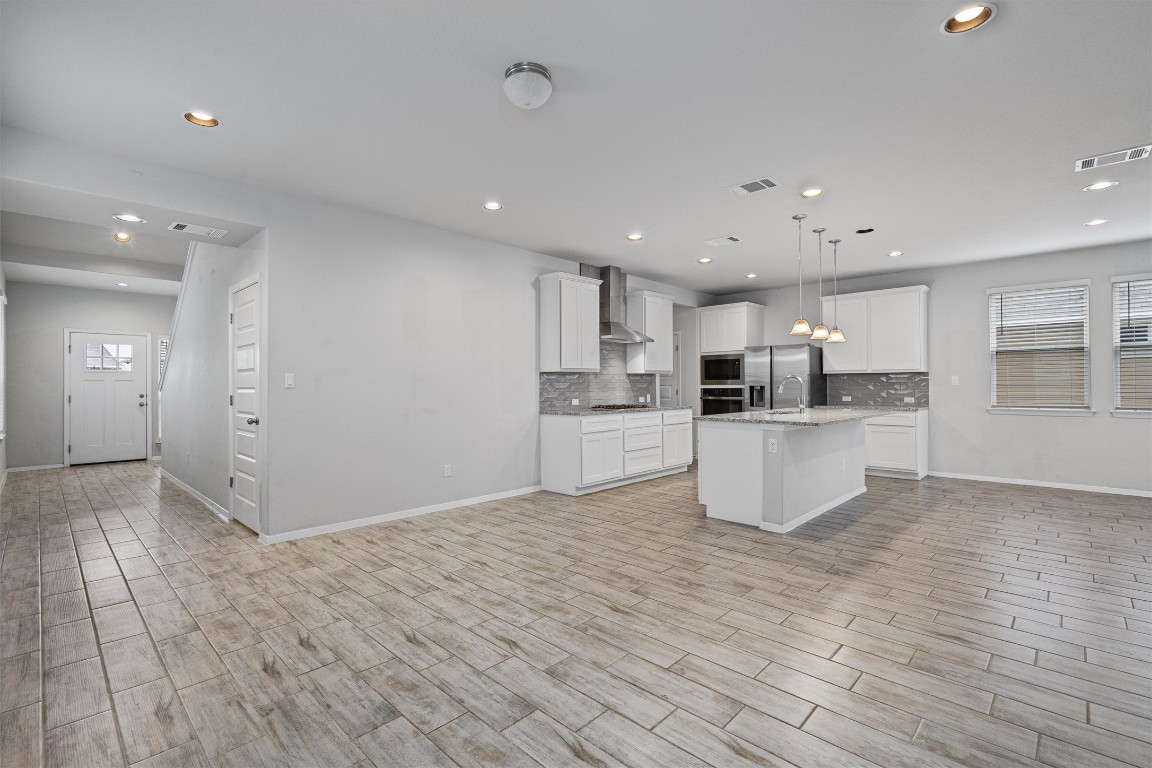 300 Delta Crest Maxwell, TX 78656 - Photo 34 of 36 a view of kitchen with wooden floor
