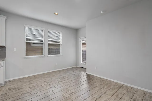 a view of an empty room with a window