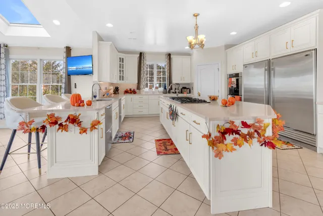 a room with pool table and windows