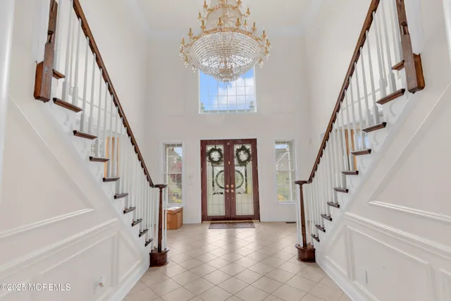 a bedroom with furniture and a flat screen tv