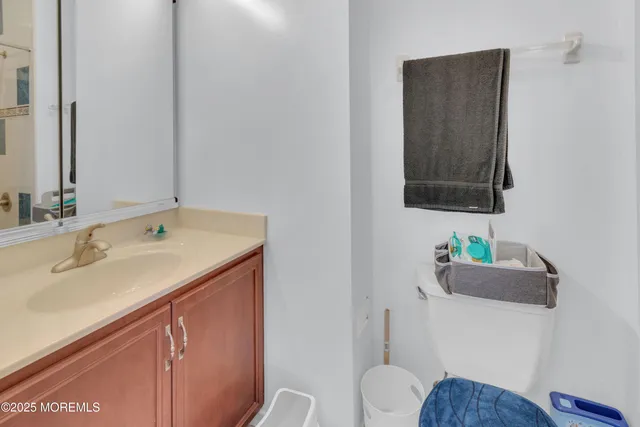 a view of a dining room with furniture large windows and wooden floor