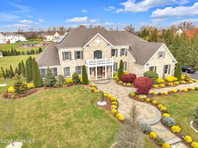 an aerial view of a house with swimming pool