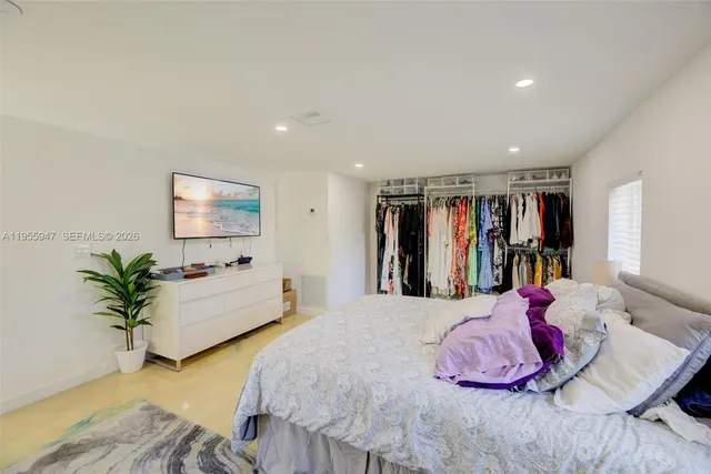 a bed room with a bed and a couch