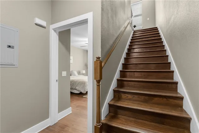 a view of entryway and hall with wooden floor