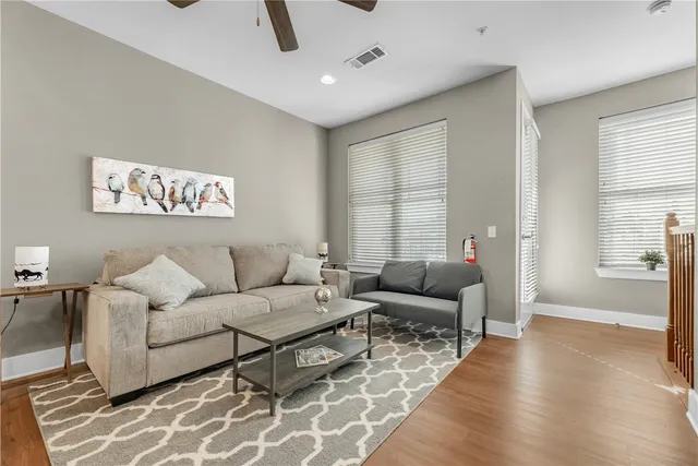 a living room with furniture and a large window