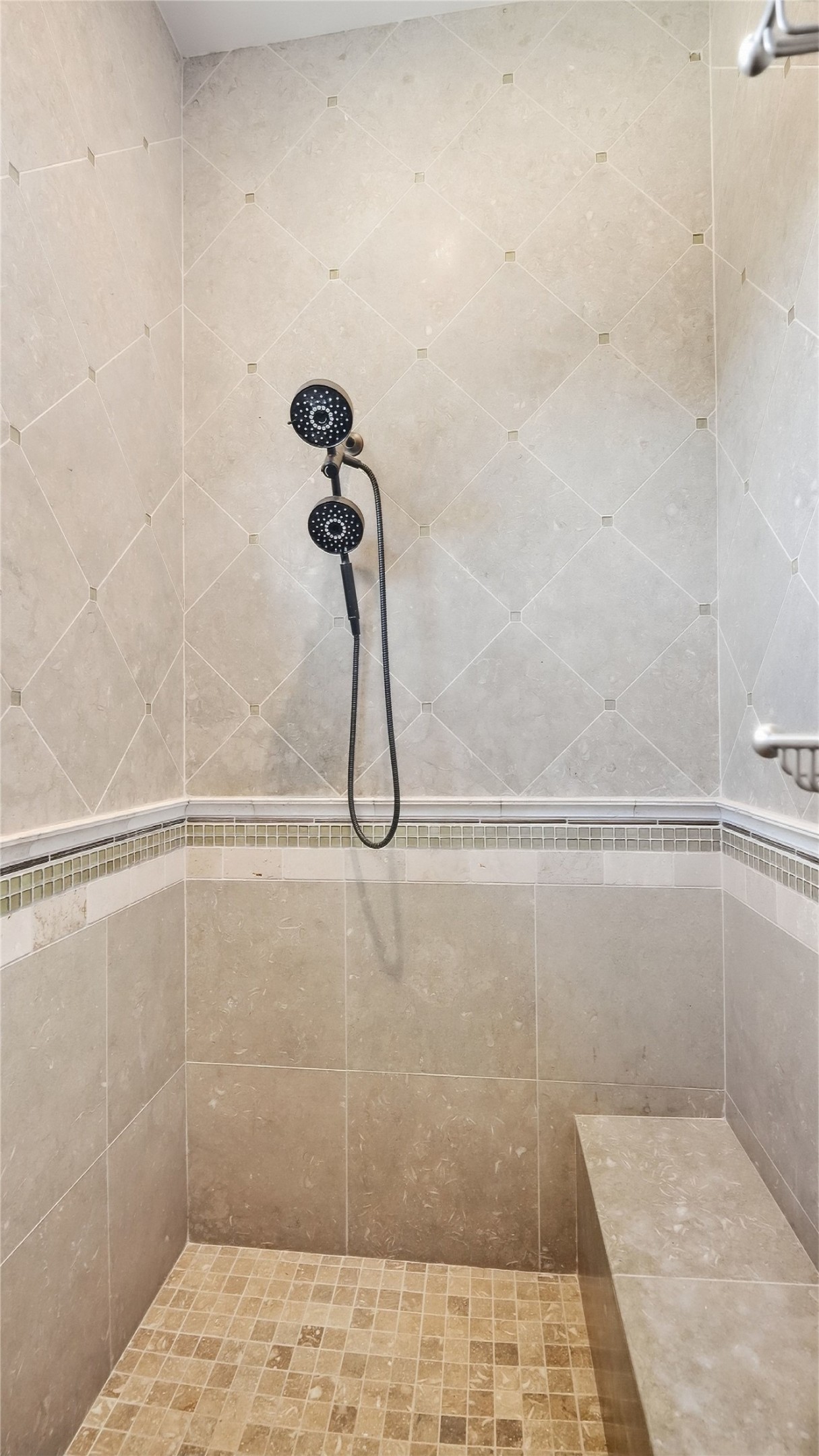 5910 Hudson Bend Road Austin, TX 78734 - Photo 27 of 40 Elegant tile details and a built-in stone bench elevate this modern walk-in shower.