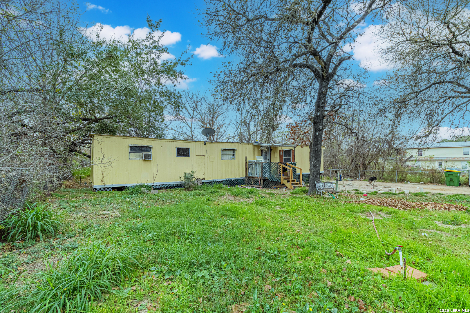369 Gateway Drive Poteet, TX 78065 - Photo 1 of 45 a view of backyard with house and trees