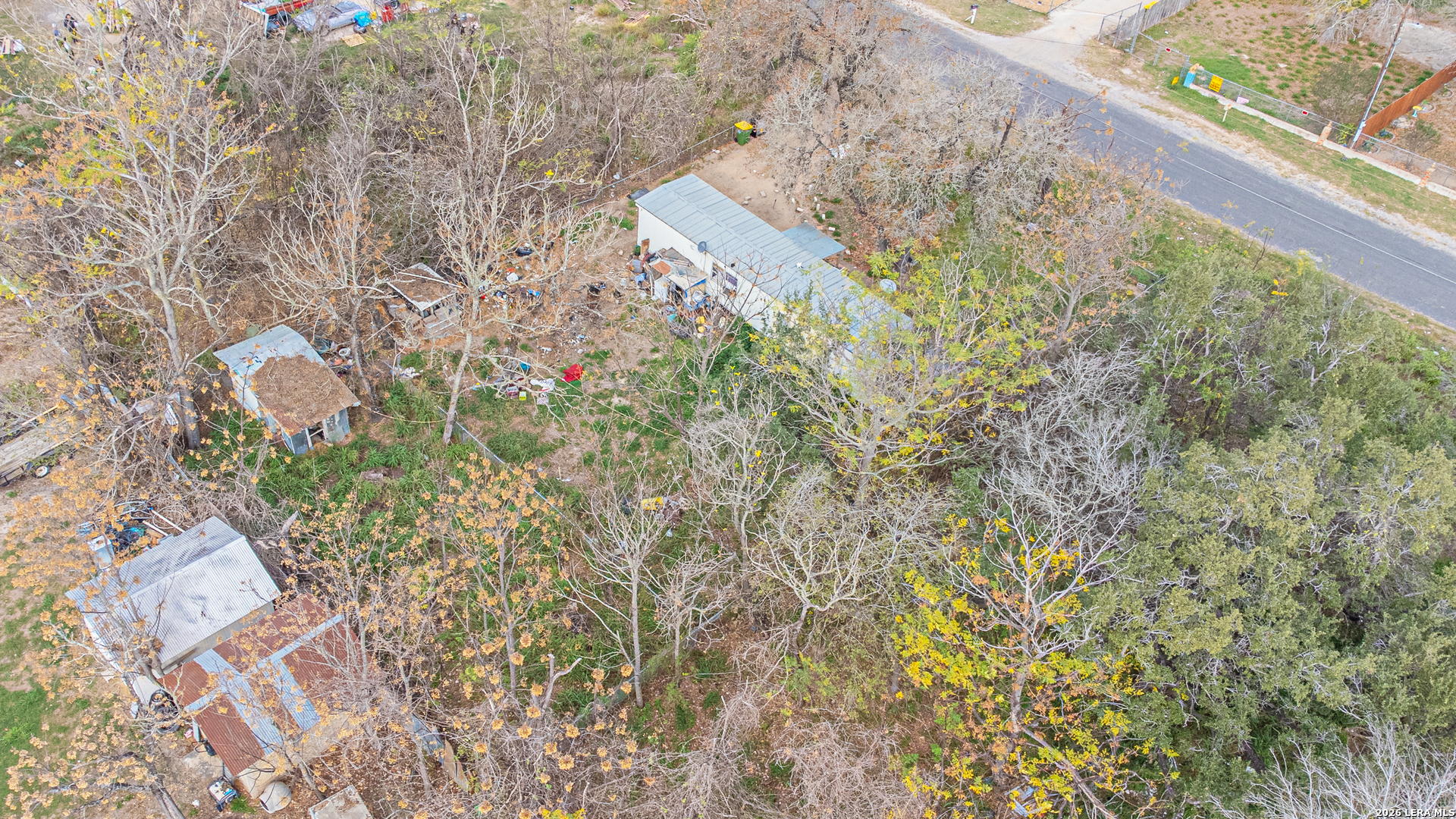 369 Gateway Drive Poteet, TX 78065 - Photo 16 of 45 a aerial view of a house with a yard and garden