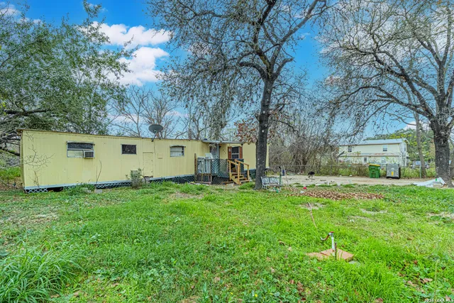 a backyard of a house with seating space