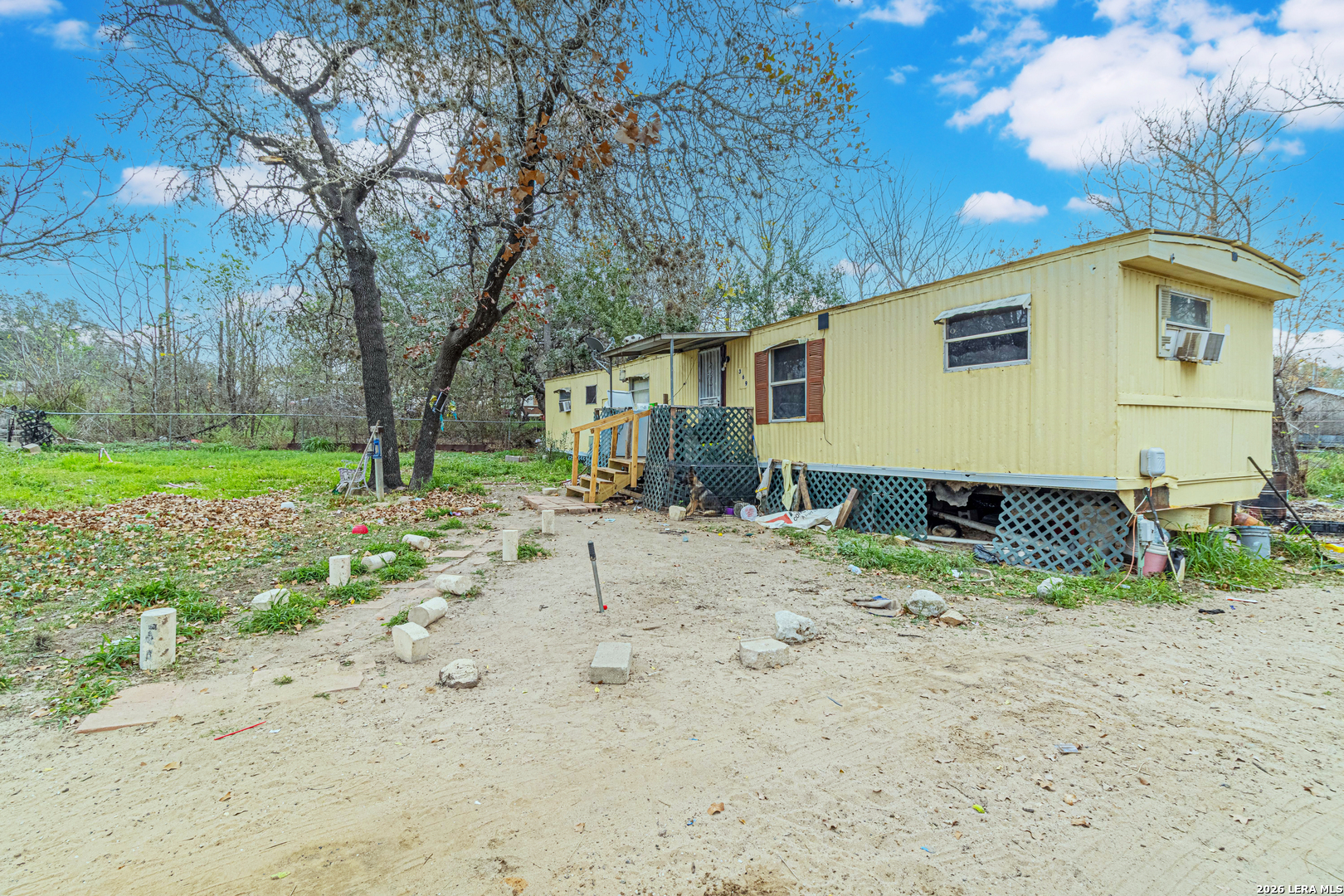 369 Gateway Drive Poteet, TX 78065 - Photo 29 of 45 a view of a backyard with large trees and plants
