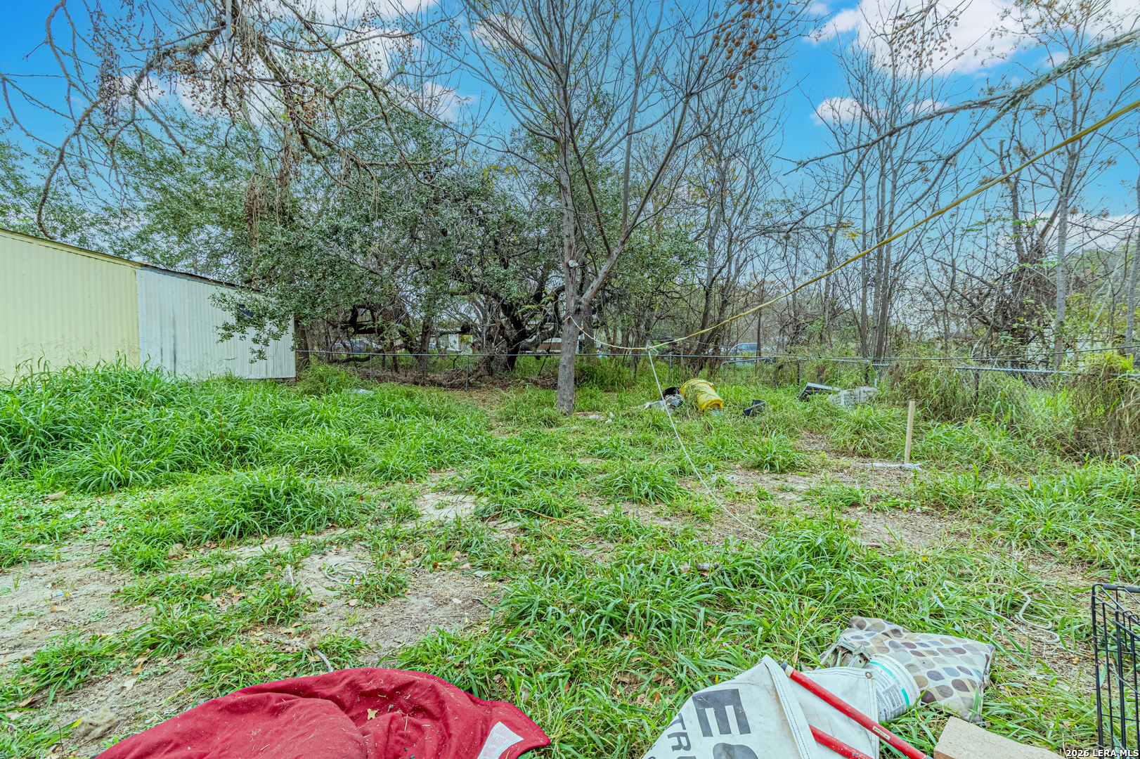 369 Gateway Drive Poteet, TX 78065 - Photo 33 of 45 a backyard of a house with lots of green space