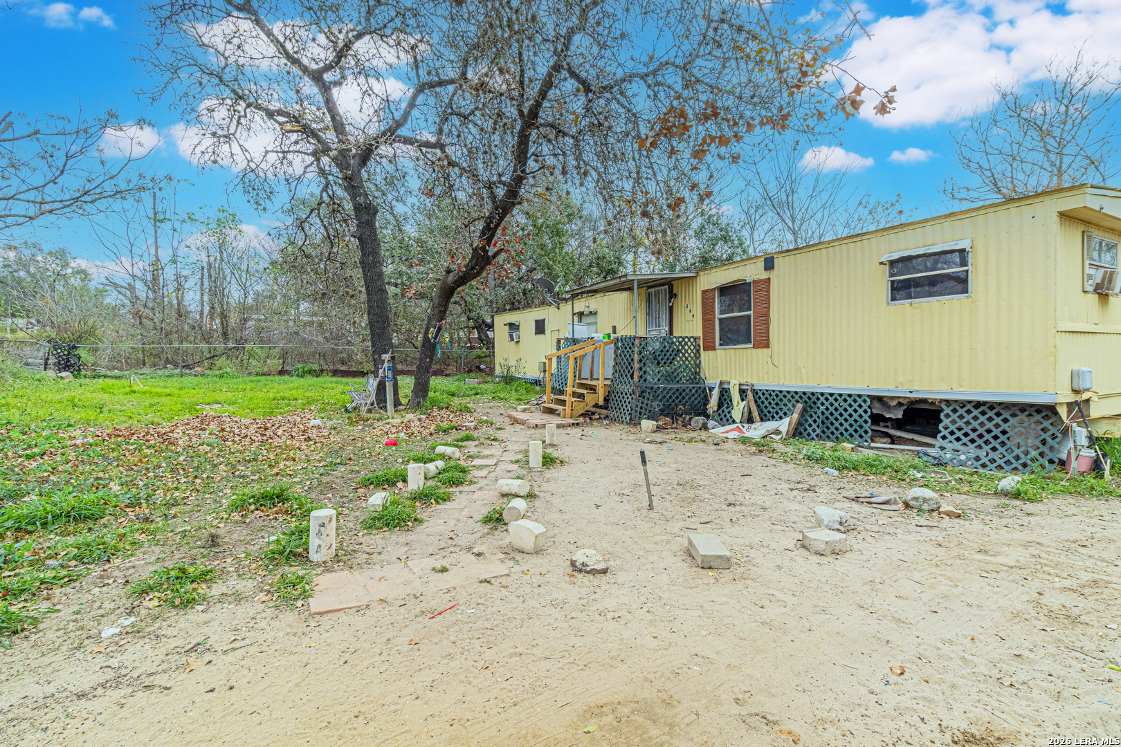 369 Gateway Drive Poteet, TX 78065 - Photo 37 of 45 a view of a yard with a house and a trees