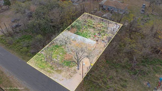 a view of swimming pool with a yard from a balcony
