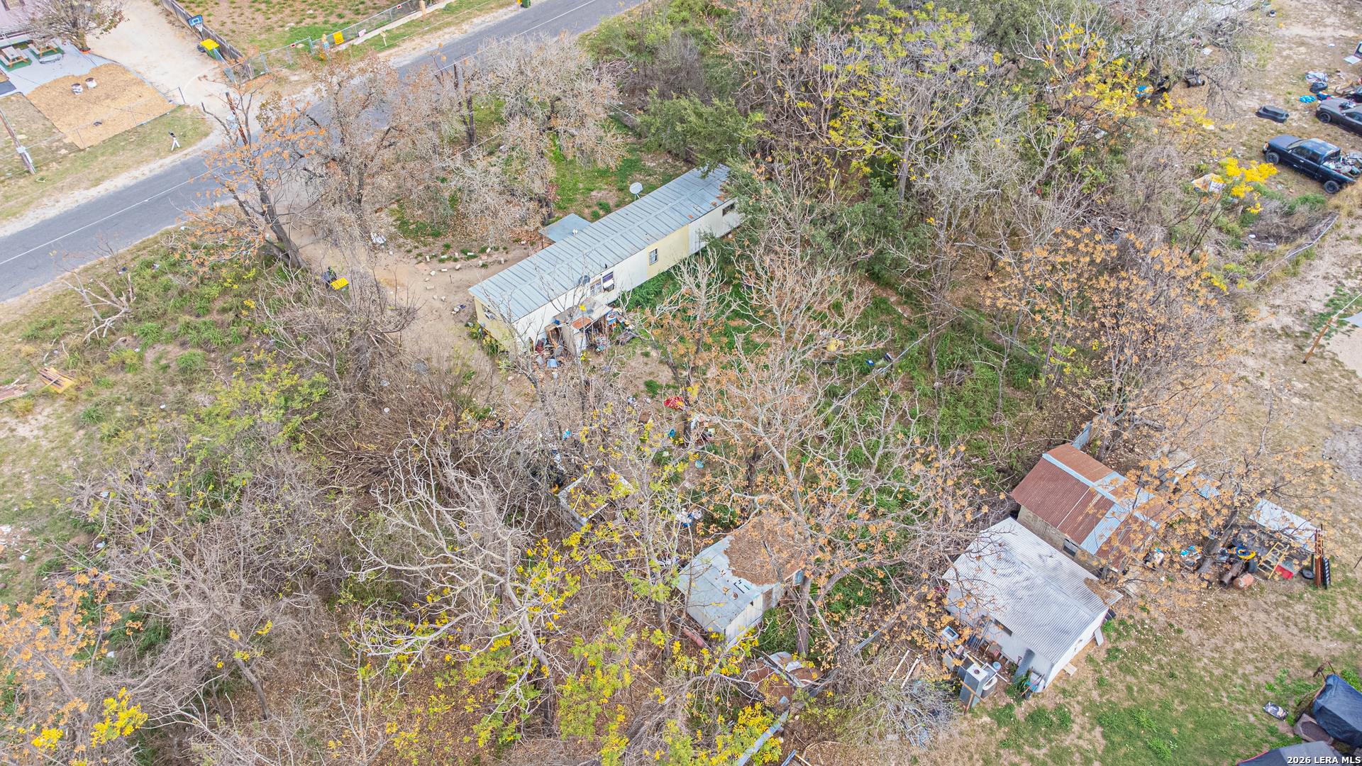 369 Gateway Drive Poteet, TX 78065 - Photo 9 of 45 a bird view of water house with large trees