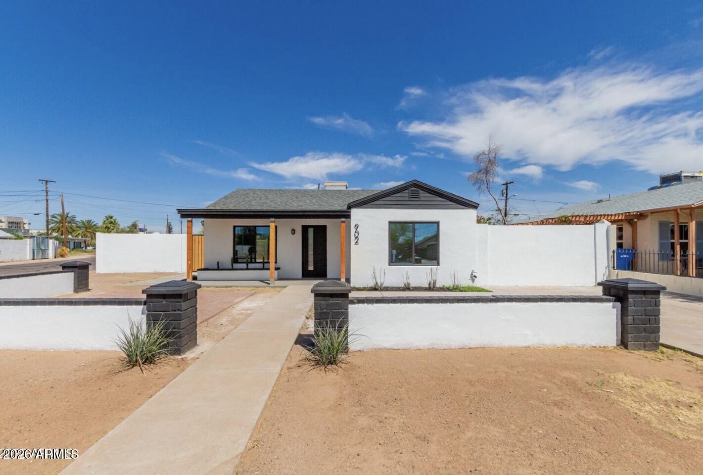 902 East Fairmount Avenue Phoenix, AZ 85014 - Photo 1 of 28 front view of a house with a patio