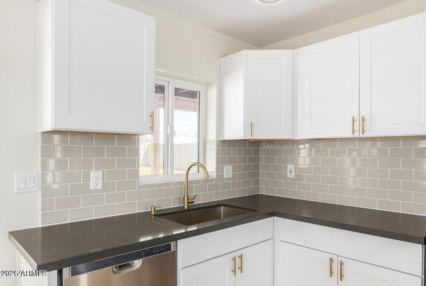 902 East Fairmount Avenue Phoenix, AZ 85014 - Photo 16 of 28 a kitchen with granite countertop a sink and a stove