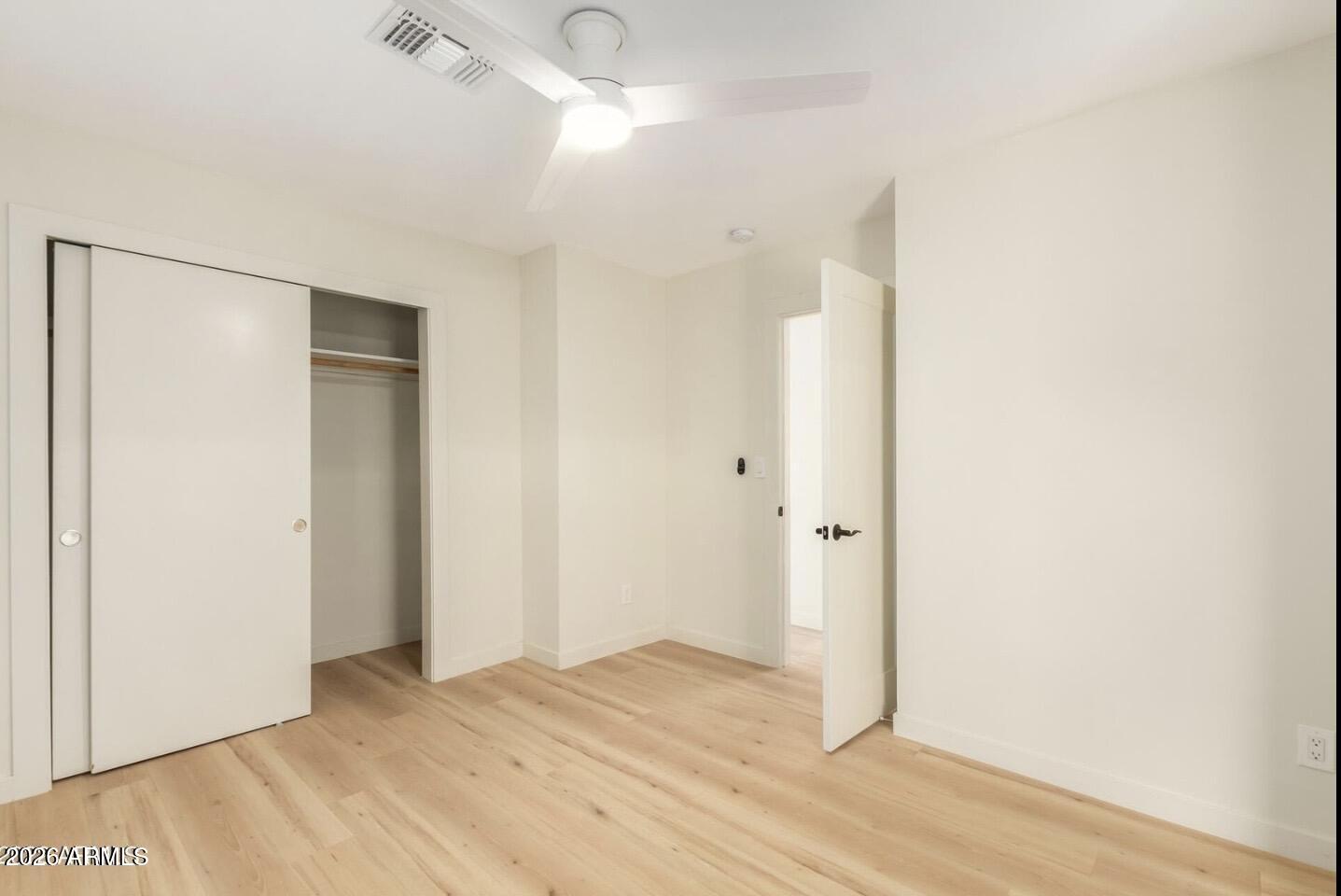 902 East Fairmount Avenue Phoenix, AZ 85014 - Photo 20 of 28 a view of an empty room with wooden floor