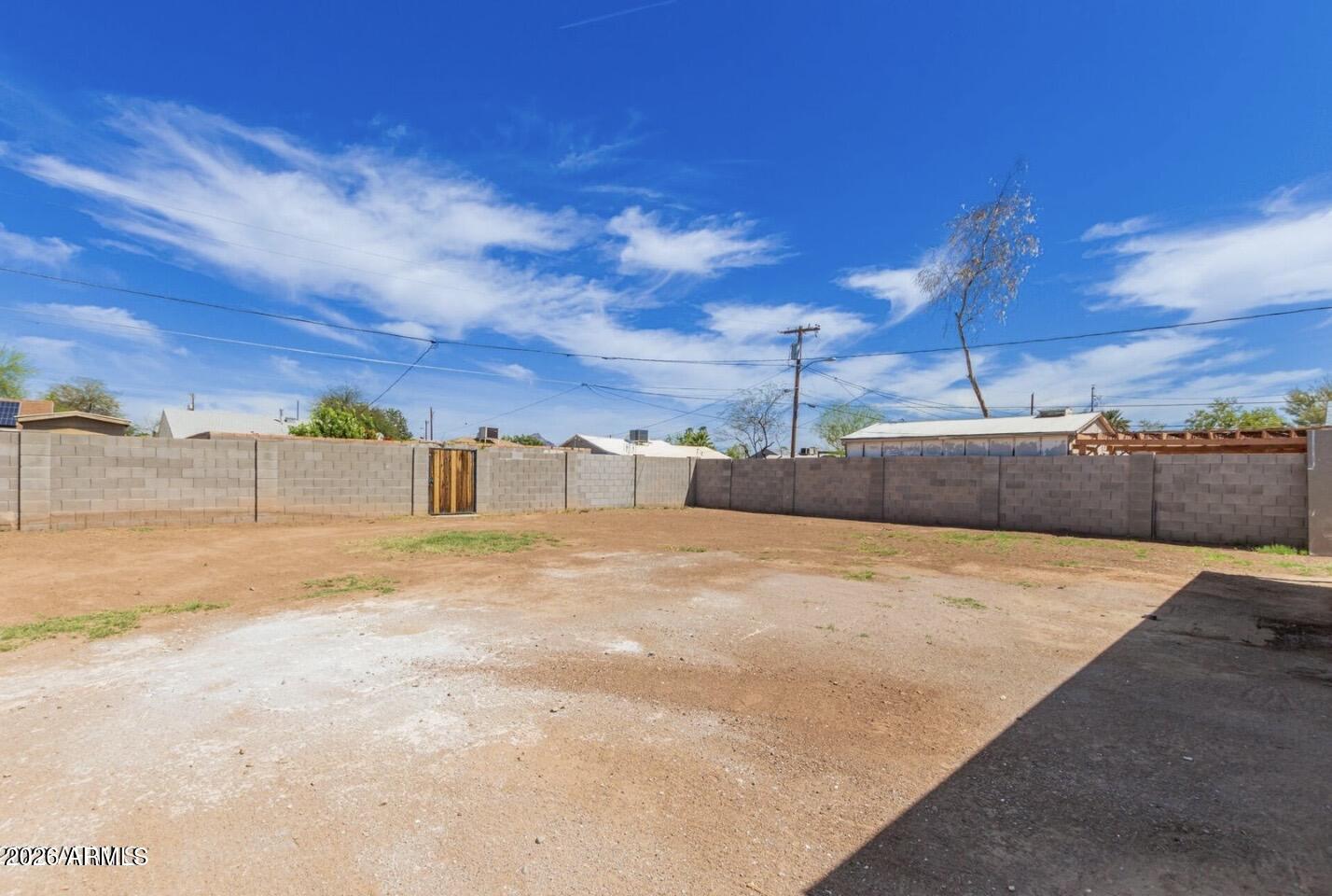 902 East Fairmount Avenue Phoenix, AZ 85014 - Photo 26 of 28 a view of empty space with wooden fence