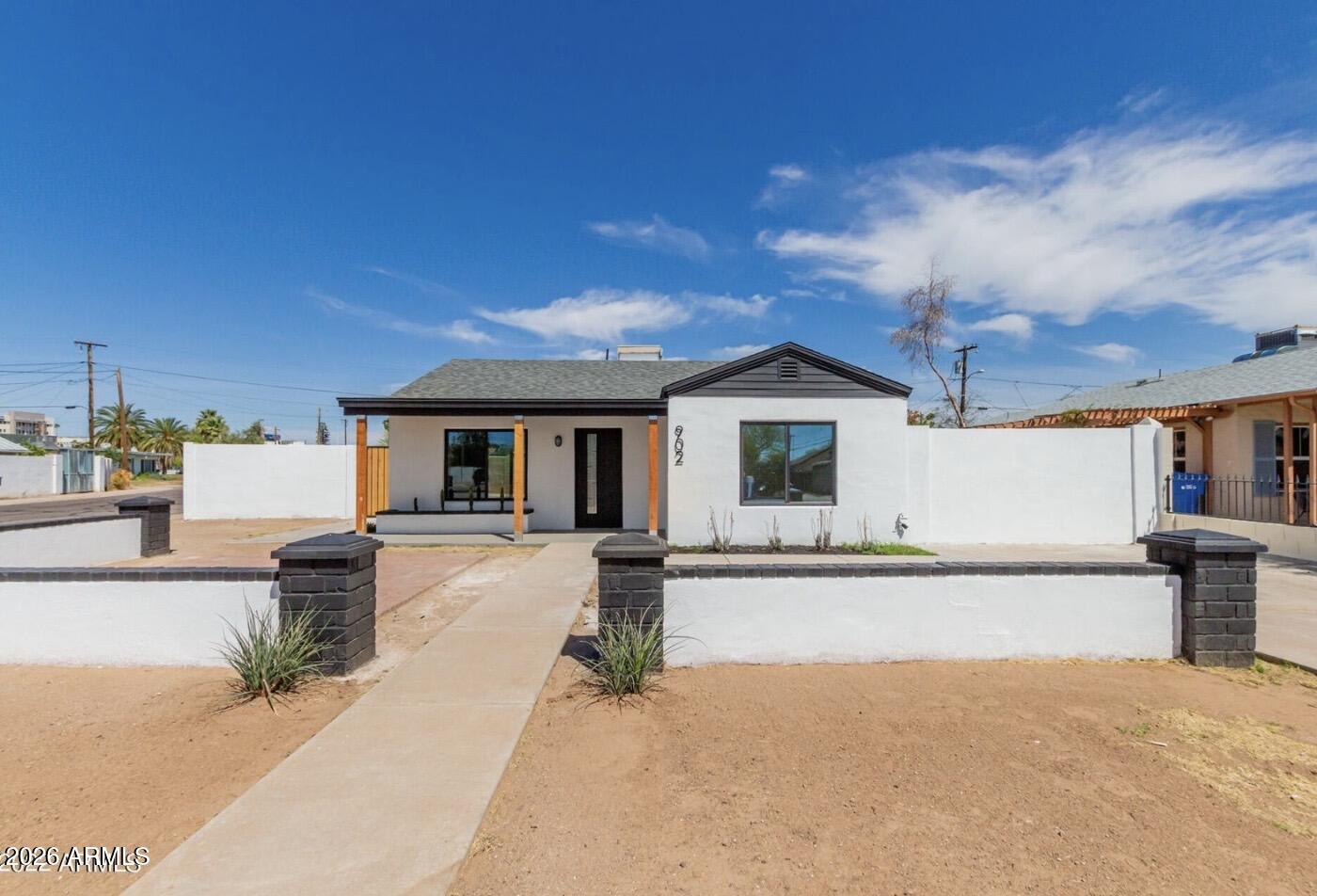 902 East Fairmount Avenue Phoenix, AZ 85014 - Photo 28 of 28 a front view of a house with basket ball court and a garage