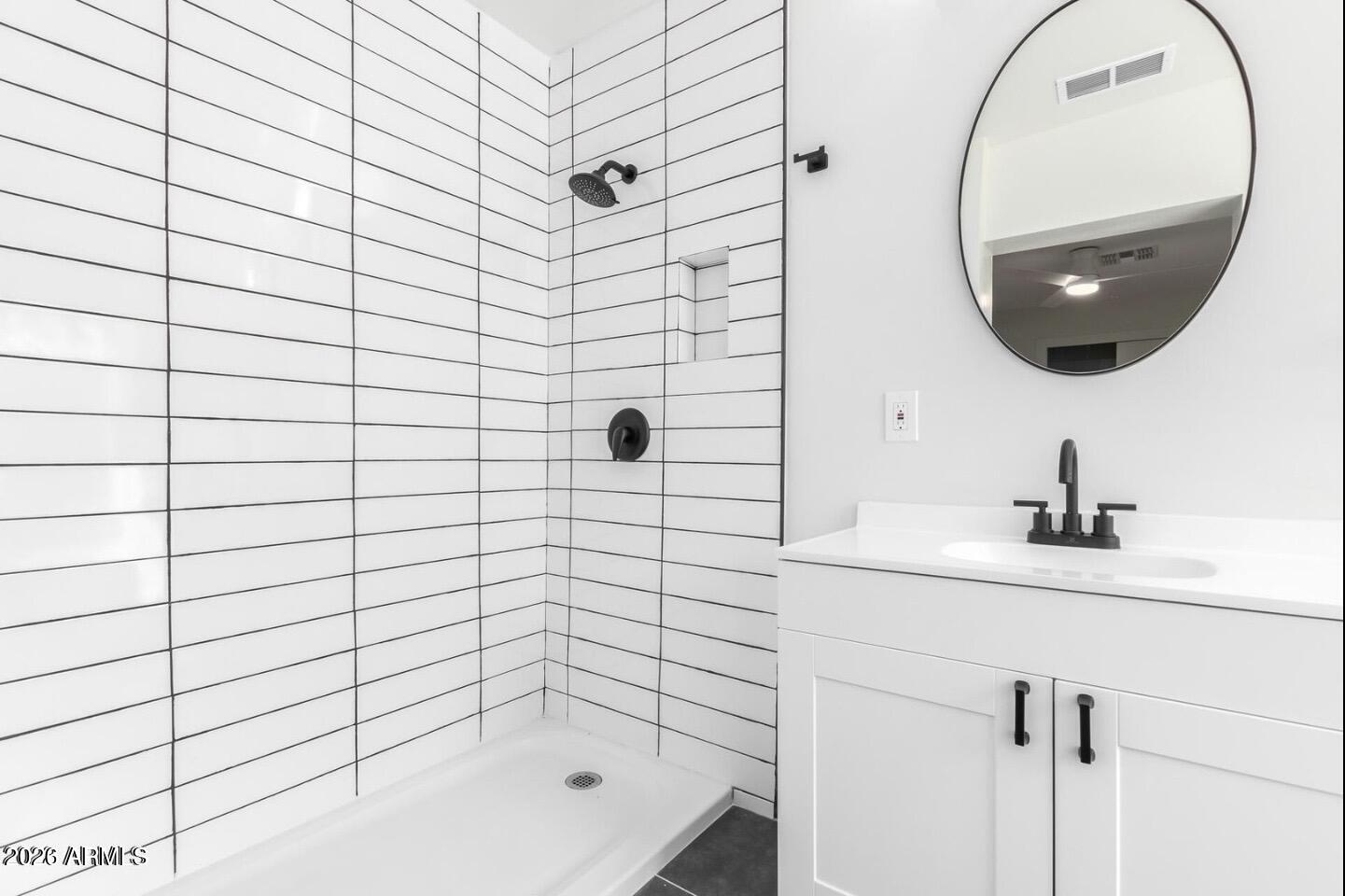 902 East Fairmount Avenue Phoenix, AZ 85014 - Photo 4 of 28 a bathroom with a sink and a mirror