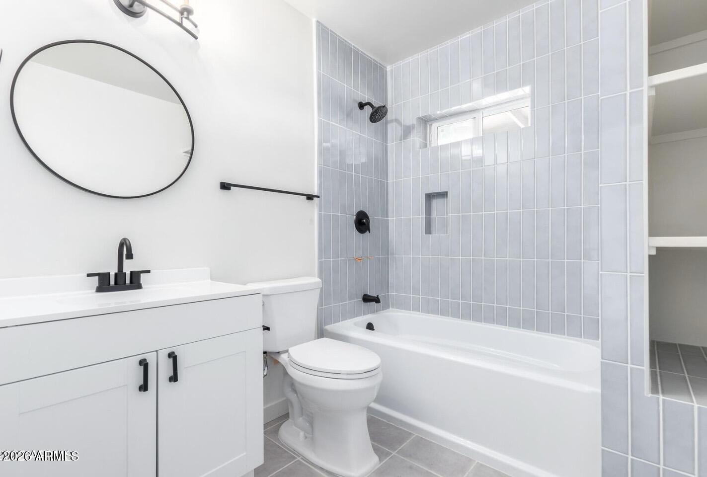 902 East Fairmount Avenue Phoenix, AZ 85014 - Photo 5 of 28 a bathroom with a sink a toilet and a mirror