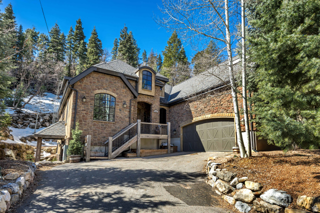 9049 Timphaven Road Sundance, UT 84604 - Photo 1 of 63 French country home featuring stone siding and asphalt driveway