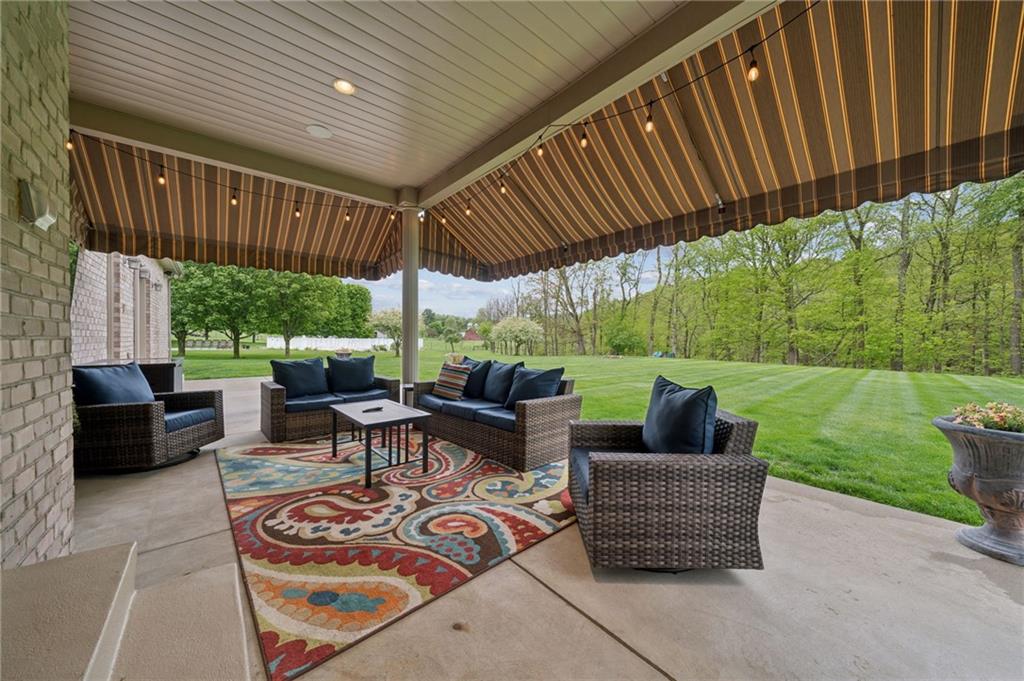 12288 Carmichael Circle Irwin, PA 15642 - Photo 38 of 47 a view of a patio with couches chairs and a yard