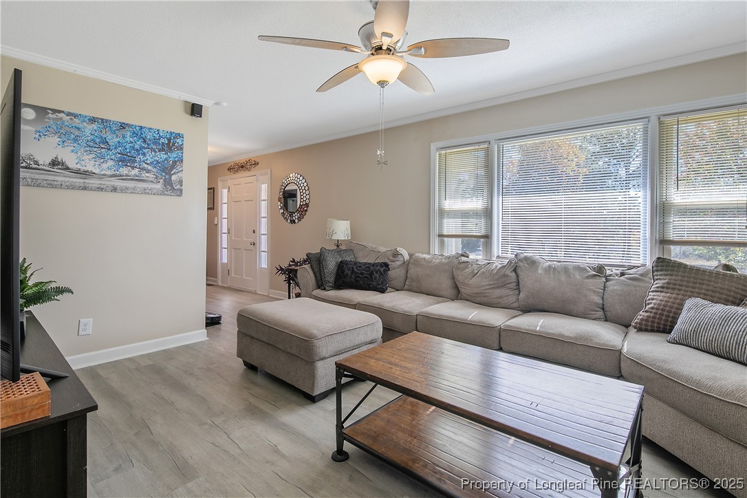 7666 Overhills Road Spring Lake, NC 28390 - Photo 11 of 50 a living room with furniture and a large window