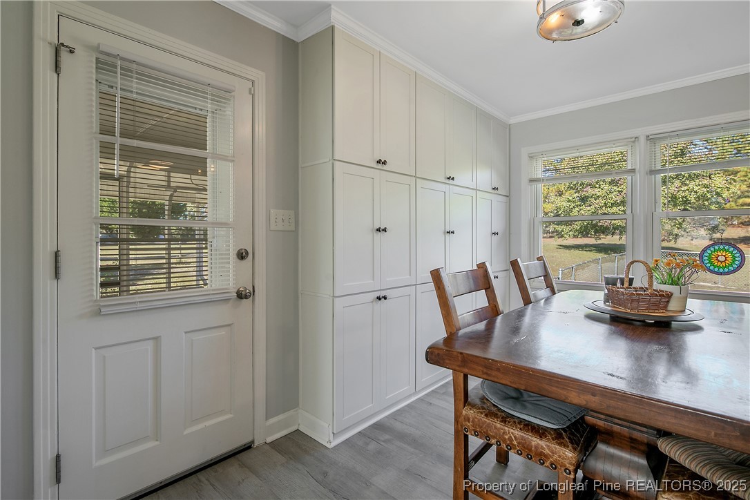 7666 Overhills Road Spring Lake, NC 28390 - Photo 12 of 50 a view of a dining room with furniture and window